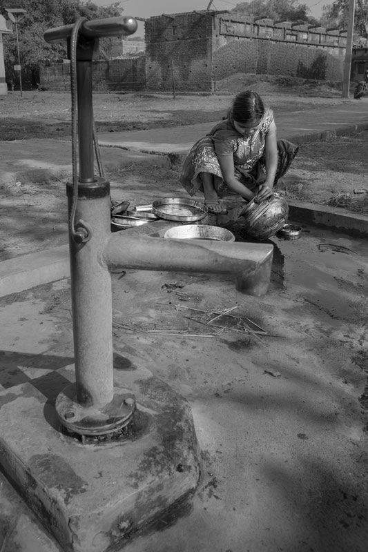 Cleaning of utensils at a community handpump in Bhojpur district, Bihar